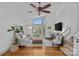 Bright living room with a large window, hardwood floors, and cozy seating at 3723 Annlin Ave, Charlotte, NC 28209