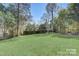 Large backyard with lush green grass at 3920 Admiral Ave, Charlotte, NC 28205