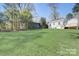 Backyard with green grass and shed at 3920 Admiral Ave, Charlotte, NC 28205