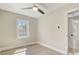 Bedroom with ceiling fan and a large window at 3920 Admiral Ave, Charlotte, NC 28205