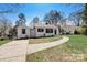 Charming single-story home with a freshly painted exterior and landscaping at 3920 Admiral Ave, Charlotte, NC 28205