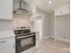 Modern kitchen featuring stainless steel appliances and white cabinetry at 3920 Admiral Ave, Charlotte, NC 28205