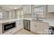 Modern kitchen with white cabinets, quartz countertops and stainless steel appliances at 3920 Admiral Ave, Charlotte, NC 28205