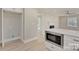 Kitchen with island, stainless steel microwave, and white cabinetry at 3920 Admiral Ave, Charlotte, NC 28205