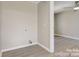 Laundry room with light flooring and access to another room at 3920 Admiral Ave, Charlotte, NC 28205