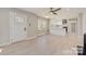 Open living room with kitchen island and modern finishes at 3920 Admiral Ave, Charlotte, NC 28205