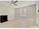 Living room with fireplace, hardwood floors, and ceiling fan at 3920 Admiral Ave, Charlotte, NC 28205