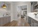 Wet bar area featuring custom cabinets and a seamless flow to the living spaces at 3945 Ostler Ct, Lancaster, SC 29720