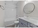 Modern bathroom with white subway tile in shower, large vanity, and round mirror at 3945 Ostler Ct, Lancaster, SC 29720