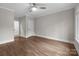 Bedroom with hardwood floors and neutral walls with access to additional rooms at 3945 Ostler Ct, Lancaster, SC 29720