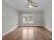 Empty bedroom with hardwood floors, large window and neutral paint at 3945 Ostler Ct, Lancaster, SC 29720