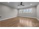 Spacious bedroom featuring hardwood floors, large windows, a ceiling fan, and neutral paint at 3945 Ostler Ct, Lancaster, SC 29720