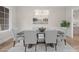 Dining room showcasing a modern chandelier, tufted chairs, and view of picturesque landscape at 3945 Ostler Ct, Lancaster, SC 29720