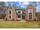 Attractive brick home with a modern farmhouse design, accented by lush green grass at 3945 Ostler Ct, Lancaster, SC 29720