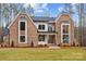 Stunning brick home with a modern farmhouse design and well-manicured lawn at 3945 Ostler Ct, Lancaster, SC 29720