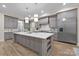 Beautiful kitchen featuring an island with white countertops, stainless steel refrigerator and appliances at 3945 Ostler Ct, Lancaster, SC 29720