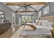 Beautiful main bedroom with vaulted ceiling, wooden beams, and sitting area by windows at 3945 Ostler Ct, Lancaster, SC 29720