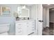 Clean bathroom with white vanity and geometric tile floor at 423 W Bell St, Statesville, NC 28677