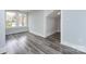 Spacious bedroom with light walls and grey wood-look floors at 423 W Bell St, Statesville, NC 28677