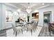 Bright dining room features a glass table, chandelier, and hardwood floors at 423 W Bell St, Statesville, NC 28677