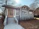 Charming craftsman home with gray siding and a wood front door at 423 W Bell St, Statesville, NC 28677