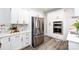 Modern kitchen with stainless steel appliances and white cabinets at 423 W Bell St, Statesville, NC 28677