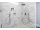 Spa-like shower with marble tile and dual shower heads at 423 W Bell St, Statesville, NC 28677