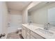 Modern bathroom with double vanity, large mirror, and bathtub at 4445 Dusty Orchard Rd, Kannapolis, NC 28081