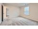 Spacious bedroom with neutral carpeting and ample natural light at 4445 Dusty Orchard Rd, Kannapolis, NC 28081