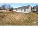 View of home's backyard with deck and grassy area at 4683 Falcon Chase Sw Dr, Concord, NC 28027