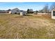 Large backyard with shed and open grassy area at 4683 Falcon Chase Sw Dr, Concord, NC 28027