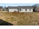 Home's backyard with wooden deck and grassy lawn at 4683 Falcon Chase Sw Dr, Concord, NC 28027