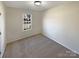 Simple bedroom with neutral walls and carpeted floor at 4683 Falcon Chase Sw Dr, Concord, NC 28027