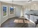 Bright kitchen with white cabinets, stainless steel appliances, and vinyl flooring at 4683 Falcon Chase Sw Dr, Concord, NC 28027