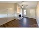 Living room with hardwood floors, fireplace, and neutral color scheme at 4683 Falcon Chase Sw Dr, Concord, NC 28027