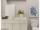 Modern bathroom with white vanity, large mirror, and stylish decor at 5725 Olive Beach Rd, Kannapolis, NC 28081