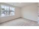 Cozy bedroom with soft carpet and large window overlooking the neighborhood at 5725 Olive Beach Rd, Kannapolis, NC 28081