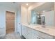 Bright bathroom with a double sink vanity, large mirror, and a separate shower room at 5725 Olive Beach Rd, Kannapolis, NC 28081