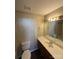 Bathroom with single sink vanity, large mirror, and a shower-tub combo at 5956 Prescott Ct, Charlotte, NC 28269