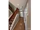 Hallway with staircase leading to the bedrooms and a view of the front door at 5956 Prescott Ct, Charlotte, NC 28269