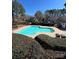 A community swimming pool with lounge chairs and well-maintained landscaping in a residential neighborhood at 5956 Prescott Ct, Charlotte, NC 28269