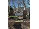 A prominent sign for Prescott Village is surrounded by brick pillars and landscaped bushes at 5956 Prescott Ct, Charlotte, NC 28269