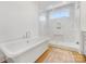 Relaxing bathroom with freestanding tub and a marble shower at 633 Mattie Rose Ln, Charlotte, NC 28204