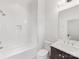 Clean bathroom with a shower/tub combo and white tile at 633 Mattie Rose Ln, Charlotte, NC 28204