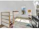 bedroom with a bunk bed, window, and geometric rug at 633 Mattie Rose Ln, Charlotte, NC 28204