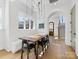 Dining area with rustic wood table and built-in bench seating at 633 Mattie Rose Ln, Charlotte, NC 28204