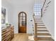 Bright entryway with hardwood floors, staircase, and arched door at 633 Mattie Rose Ln, Charlotte, NC 28204