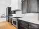 Stainless steel appliances and white quartz countertops highlight this kitchen at 633 Mattie Rose Ln, Charlotte, NC 28204