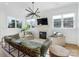 Living room with fireplace, herringbone accent wall and comfy seating at 633 Mattie Rose Ln, Charlotte, NC 28204