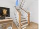 Modern staircase with white railings and oak steps at 633 Mattie Rose Ln, Charlotte, NC 28204